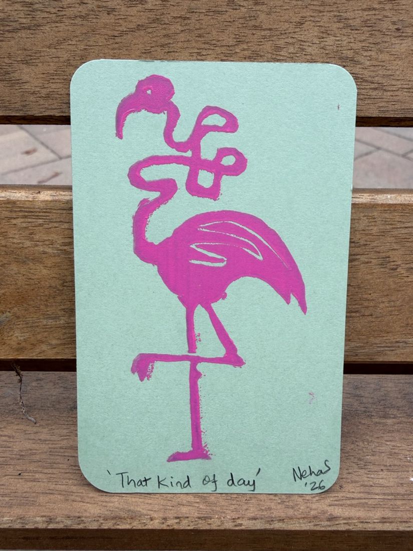A tiny linocut print of a flamingo with its neck in a knot, titled That kind of day, standing on a park bench